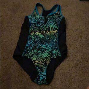 black bathing suit with green Hawaiian flowers